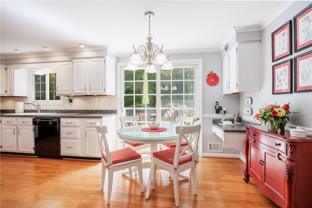 22 Red Leaf Dr, Chili, NY 14624 - kitchen with black dishwasher, a chandelier, white cabinets, dark countertops, and crown molding