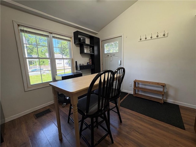 7 E St, Oneonta, NY 13820 - dining space featuring lofted ceiling, dark wood-style floors, and a bar