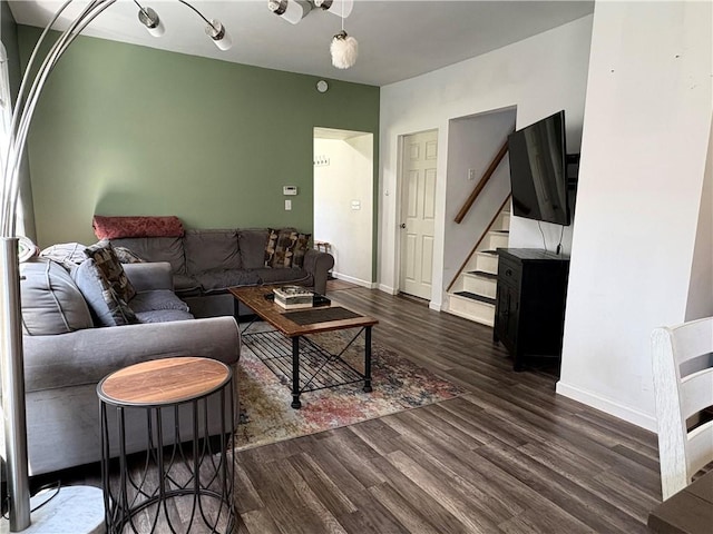 7 E St, Oneonta, NY 13820 - living area featuring dark wood-style floors and stairs