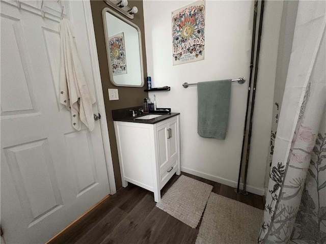 7 E St, Oneonta, NY 13820 - full bath featuring wood finished floors, vanity, and a shower with curtain