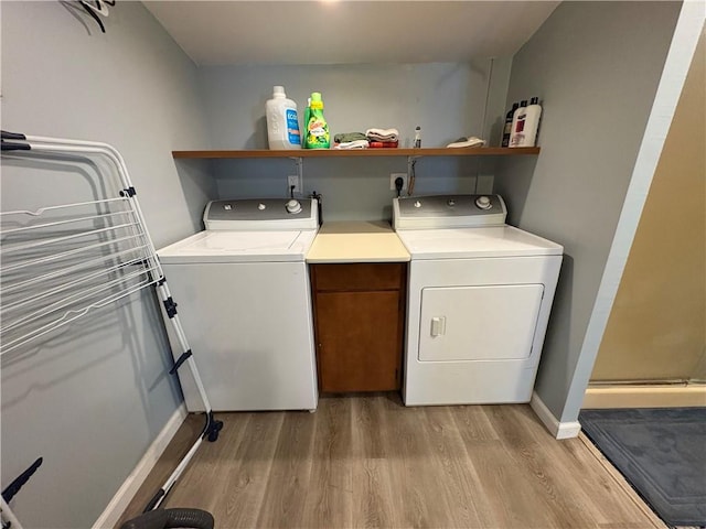 7 E St, Oneonta, NY 13820 - laundry area with washer and dryer and light wood-style floors