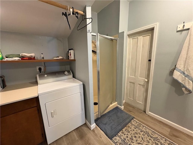 7 E St, Oneonta, NY 13820 - washroom with washer / dryer and light wood finished floors