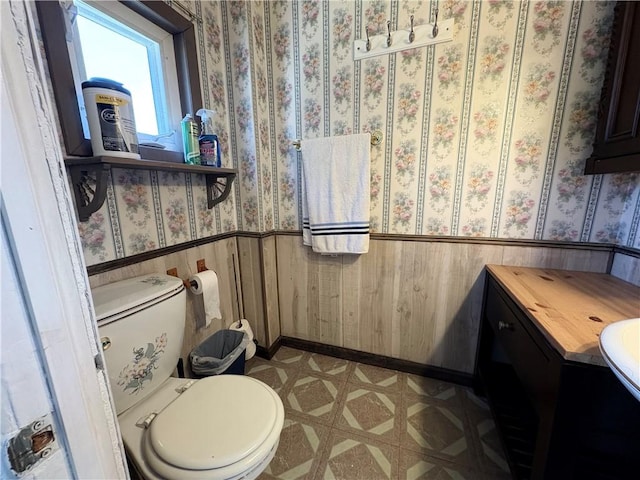 7 E St, Oneonta, NY 13820 - half bath with wainscoting, tile patterned floors, and vanity