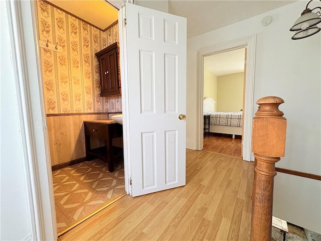 7 E St, Oneonta, NY 13820 - hallway featuring light wood-style floors and wainscoting