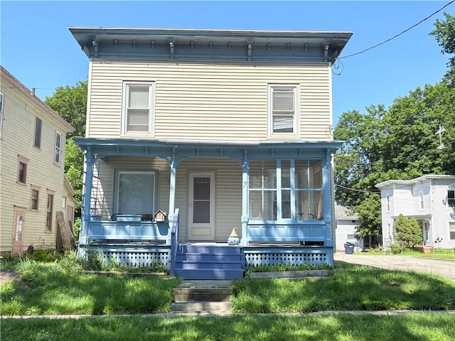 7 E St, Oneonta, NY 13820 - italianate-style house featuring covered porch
