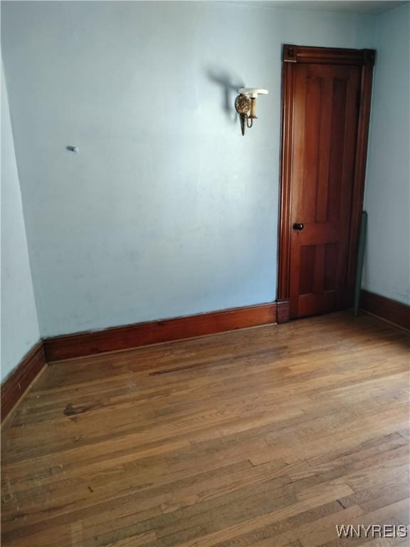 20 Chenango St, Buffalo, NY 14213 - empty room with wood finished floors and baseboards