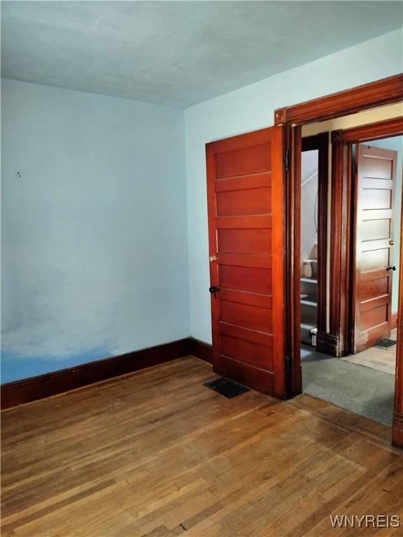 20 Chenango St, Buffalo, NY 14213 - empty room with wood finished floors and baseboards