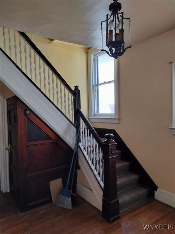 20 Chenango St, Buffalo, NY 14213 - stairway with a chandelier and wood finished floors