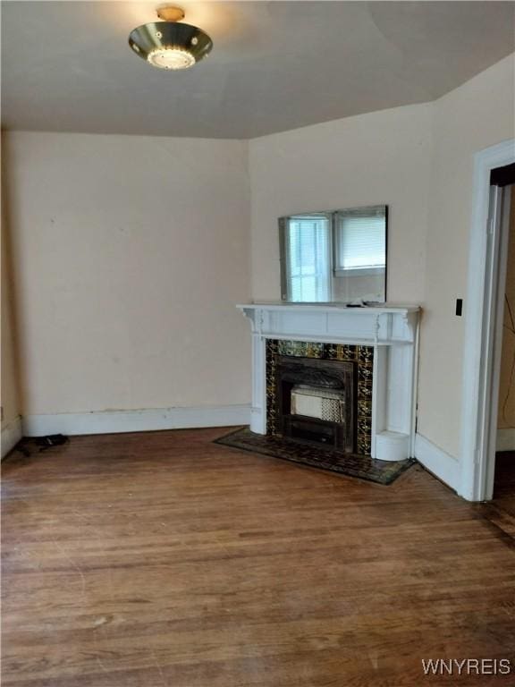 20 Chenango St, Buffalo, NY 14213 - unfurnished living room with wood finished floors and a fireplace