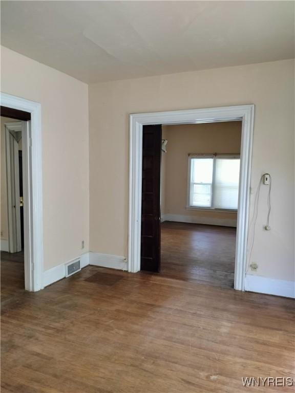 20 Chenango St, Buffalo, NY 14213 - unfurnished room with wood finished floors and baseboards