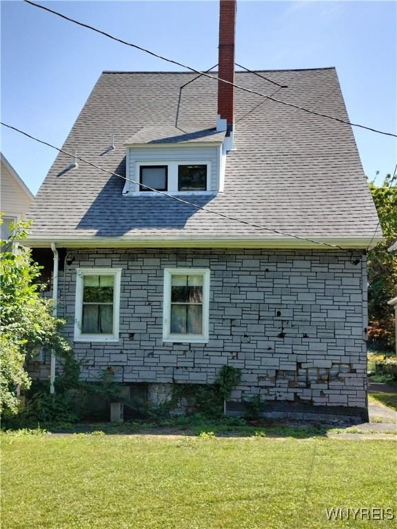 20 Chenango St, Buffalo, NY 14213 - view of side of property with a yard and a chimney