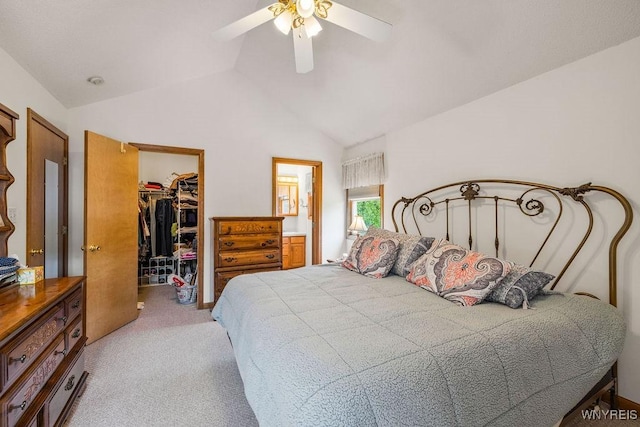701 Walker Dr, Lewiston, NY 14092 - bedroom with lofted ceiling, light colored carpet, a walk in closet, a closet, and ceiling fan