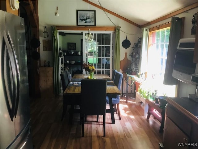 9512 Stillwater Rd, Watson, NY 13367 - dining space featuring lofted ceiling and wood finished floors