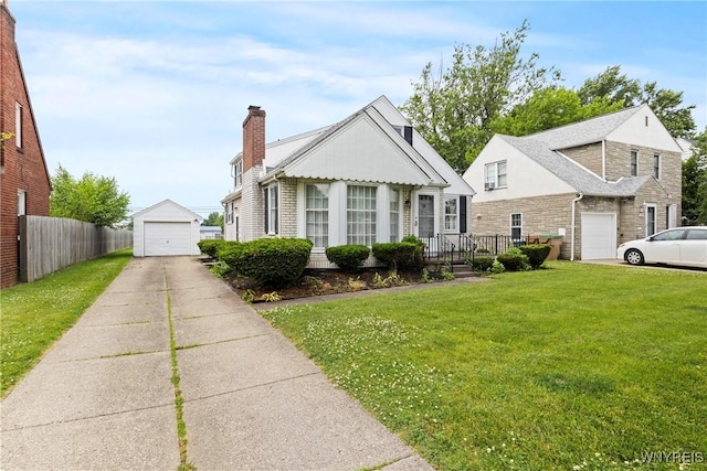 194 Woodridge Ave, Cheektowaga, NY 14225 - view of front of house featuring a garage, a chimney, and an outbuilding