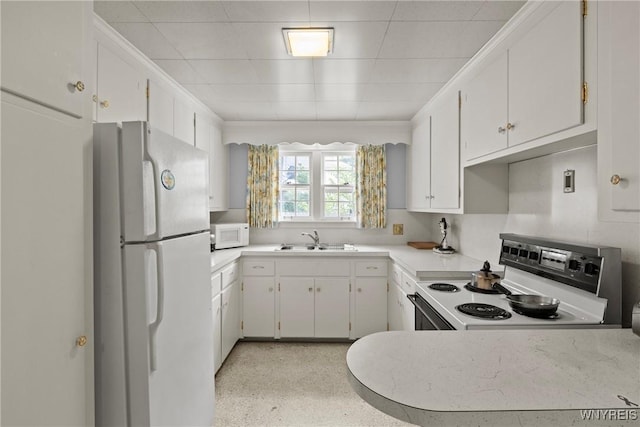 194 Woodridge Ave, Cheektowaga, NY 14225 - kitchen featuring white appliances, light countertops, white cabinetry, a paneled ceiling, and dark speckled floor