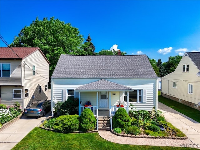 368 Cayuga Creek Rd, Cheektowaga, NY 14227 - bungalow-style home featuring a porch, a chimney, a front yard, and roof with shingles
