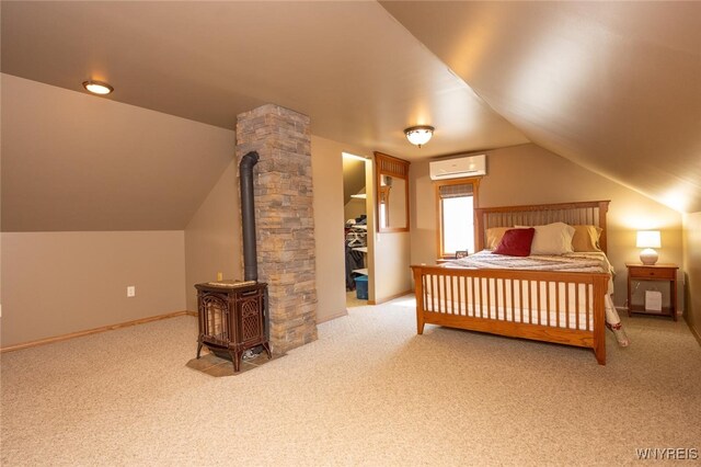 368 Cayuga Creek Rd, Cheektowaga, NY 14227 - bedroom featuring a wall unit AC, a wood stove, carpet, lofted ceiling, and a spacious closet