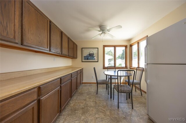 368 Cayuga Creek Rd, Cheektowaga, NY 14227 - dining space featuring ceiling fan and baseboards