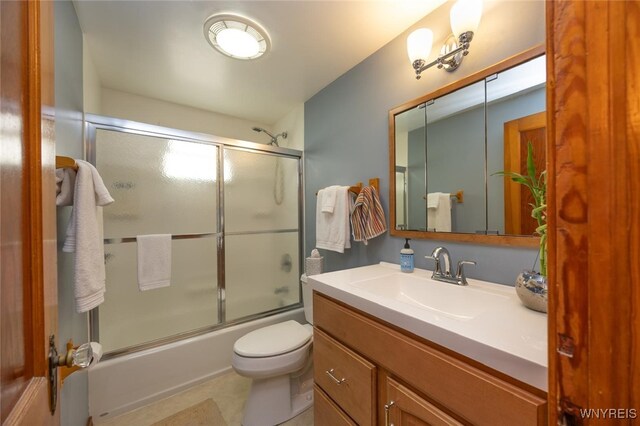 368 Cayuga Creek Rd, Cheektowaga, NY 14227 - bathroom featuring vanity, bath / shower combo with glass door, and tile patterned floors