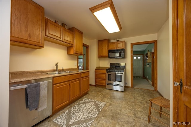 368 Cayuga Creek Rd, Cheektowaga, NY 14227 - kitchen featuring stainless steel appliances and brown cabinetry