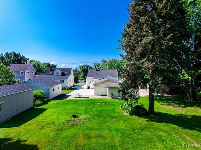 368 Cayuga Creek Rd, Cheektowaga, NY 14227 - view of grassy yard with a residential view, a patio, and an outbuilding