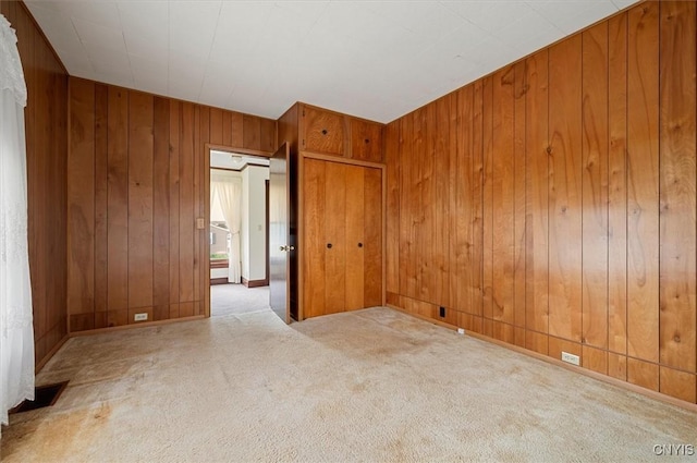 51 State St, Vernon, NY 13421 - unfurnished room with wooden walls and carpet