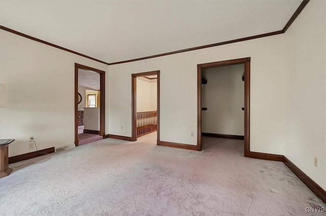 51 State St, Vernon, NY 13421 - unfurnished bedroom featuring light carpet, ornamental molding, and a walk in closet