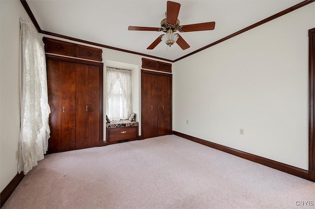 51 State St, Vernon, NY 13421 - unfurnished bedroom featuring light carpet, ornamental molding, two closets, and a ceiling fan