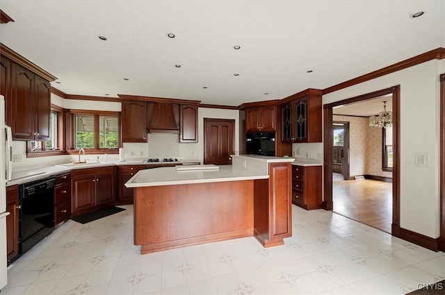 51 State St, Vernon, NY 13421 - kitchen featuring black appliances, a chandelier, light countertops, a kitchen island, and custom exhaust hood