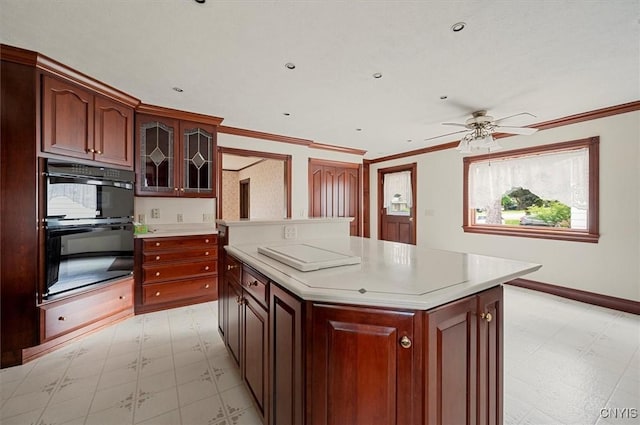 51 State St, Vernon, NY 13421 - kitchen with light floors, light countertops, ceiling fan, glass insert cabinets, and crown molding