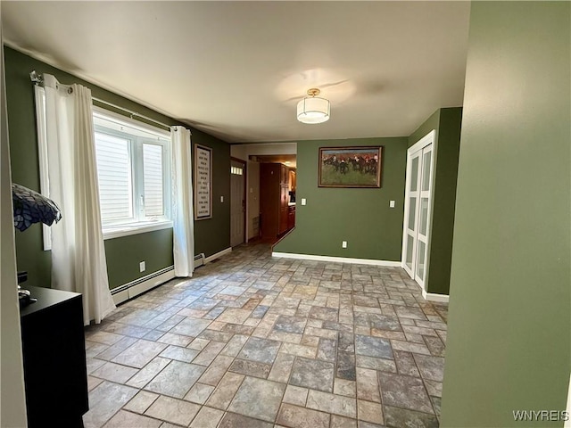 80 Fredro St, Buffalo, NY 14206 - empty room with stone tile flooring, baseboard heating, and a baseboard radiator