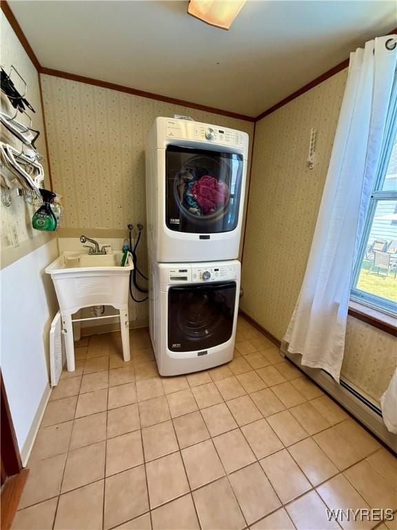 80 Fredro St, Buffalo, NY 14206 - washroom with stacked washing machine and dryer, crown molding, wallpapered walls, and light tile patterned floors