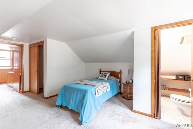 473 Seneca Creek Rd, West Seneca, NY 14224 - carpeted bedroom featuring lofted ceiling and connected bathroom