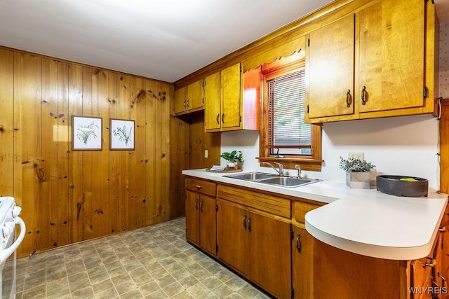 473 Seneca Creek Rd, West Seneca, NY 14224 - kitchen featuring brown cabinetry, light countertops, light flooring, wood walls, and range