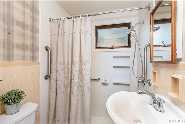 473 Seneca Creek Rd, West Seneca, NY 14224 - bathroom featuring tile walls and a shower with shower curtain