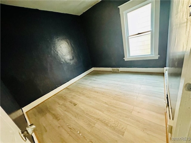 67 Holmes St, Buffalo, NY 14207 - empty room with wood finished floors and baseboards