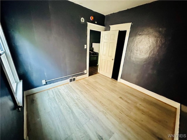 67 Holmes St, Buffalo, NY 14207 - spare room with wood finished floors and baseboards