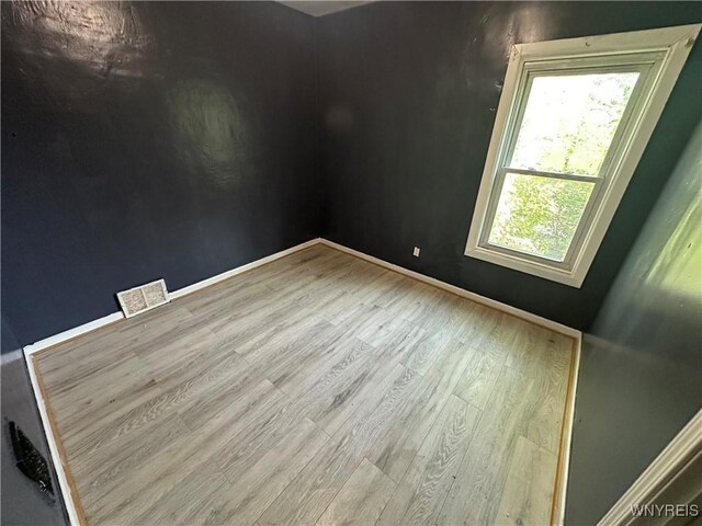 67 Holmes St, Buffalo, NY 14207 - unfurnished room with wood finished floors and baseboards