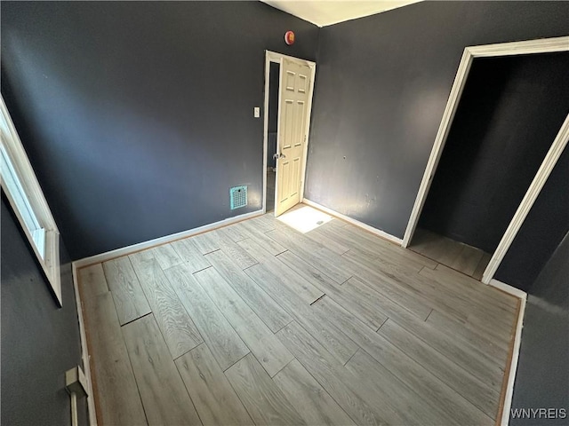 67 Holmes St, Buffalo, NY 14207 - unfurnished room with wood finished floors and baseboards