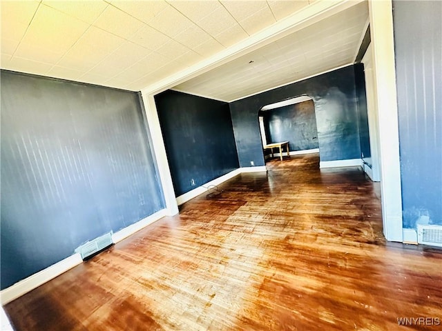 67 Holmes St, Buffalo, NY 14207 - empty room with arched walkways and wood finished floors