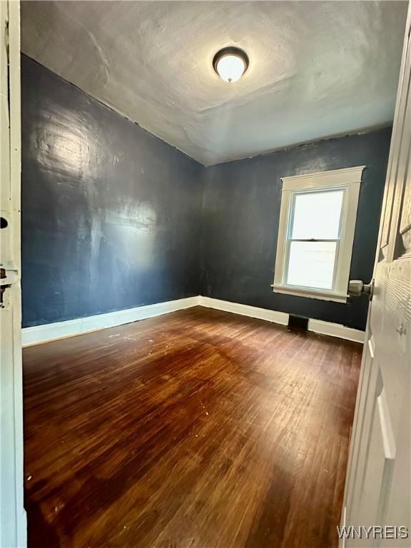67 Holmes St, Buffalo, NY 14207 - spare room with hardwood / wood-style floors and baseboards