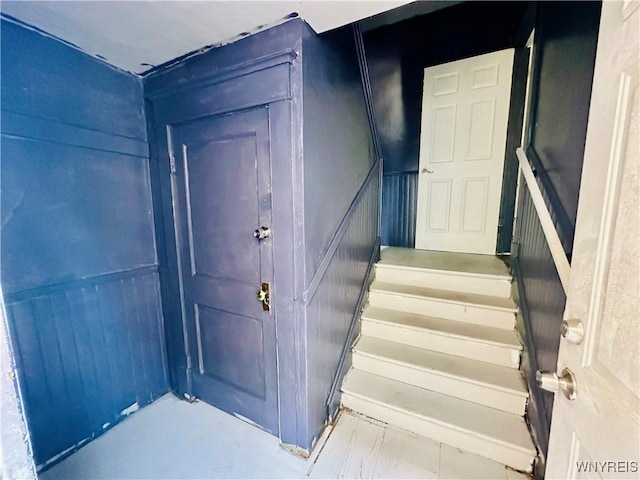 67 Holmes St, Buffalo, NY 14207 - stairway featuring a decorative wall and a wainscoted wall