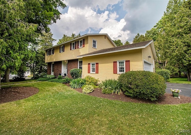 101 Luan Cir, Dewitt, NY 13078 - view of front of house featuring an attached garage and a front yard
