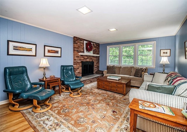 101 Luan Cir, Dewitt, NY 13078 - living room with wood finished floors, crown molding, and a brick fireplace