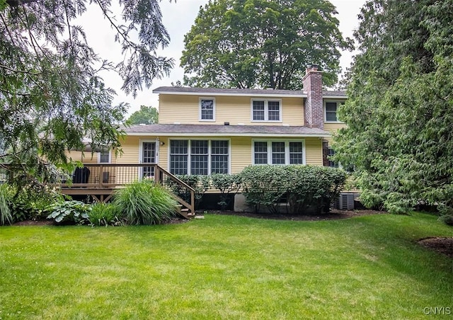 101 Luan Cir, Dewitt, NY 13078 - rear view of property featuring a wooden deck, a yard, and a chimney
