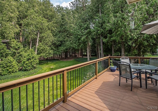 101 Luan Cir, Dewitt, NY 13078 - wooden deck featuring outdoor dining area and a lawn