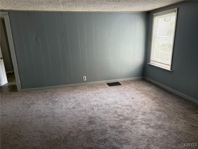231 N Main St, Oneida, NY 13421 - spare room featuring a textured ceiling and carpet floors