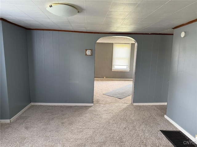 231 N Main St, Oneida, NY 13421 - empty room featuring arched walkways, carpet floors, crown molding, and a smoke detector