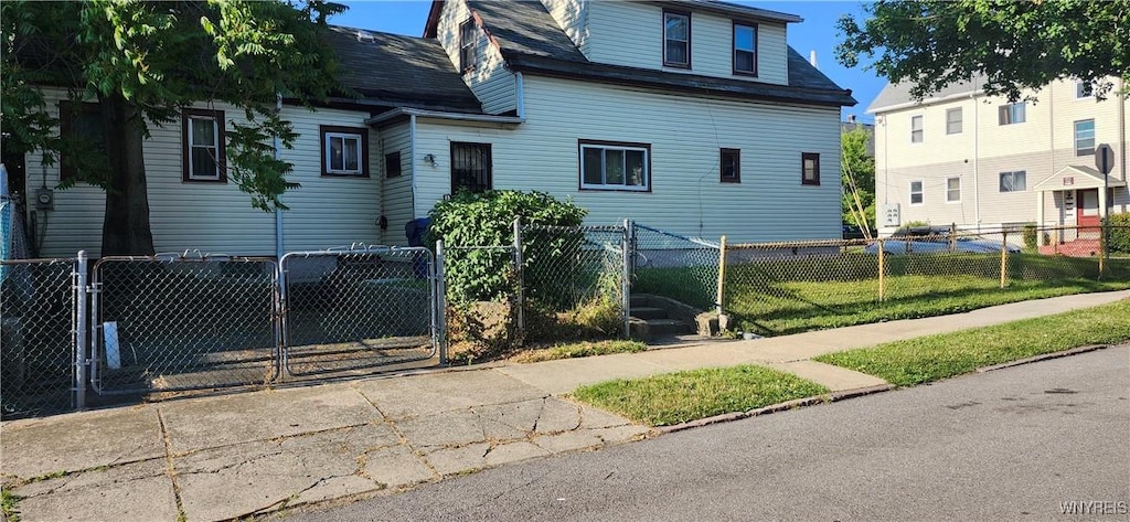 4 Regina Pl, Buffalo, NY 14208 - view of front of house with a fenced front yard, roof with shingles, and a gate