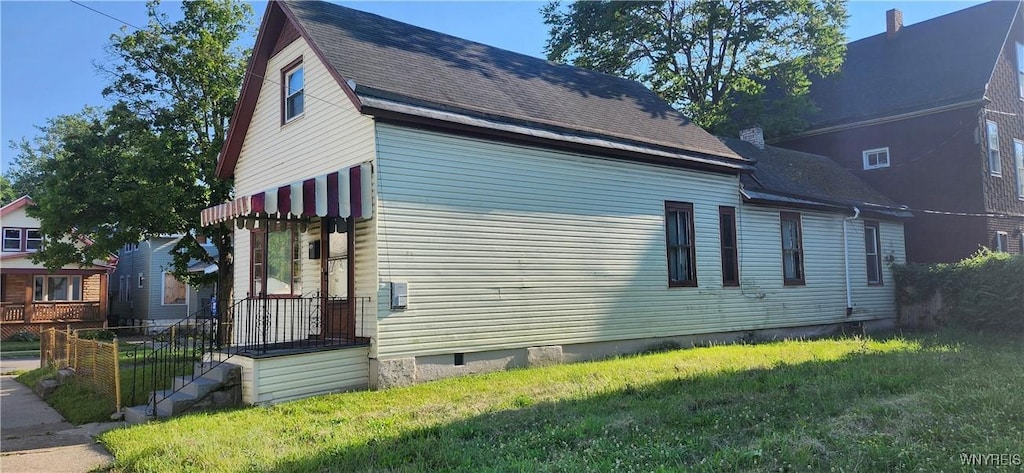 4 Regina Pl, Buffalo, NY 14208 - view of home's exterior with a lawn, crawl space, and roof with shingles